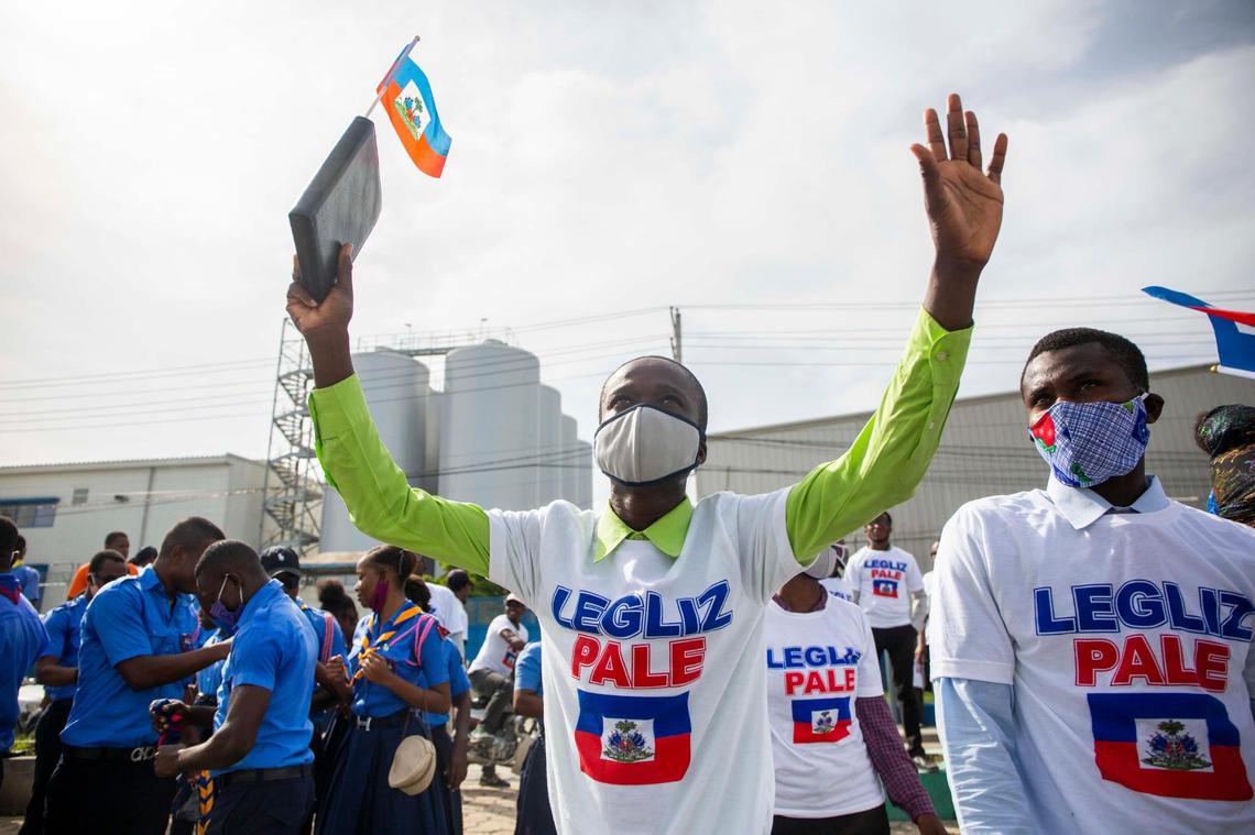 Haitian members of a church pray during a protest against gay rights in Port-au-Prince on July 26, 2020.