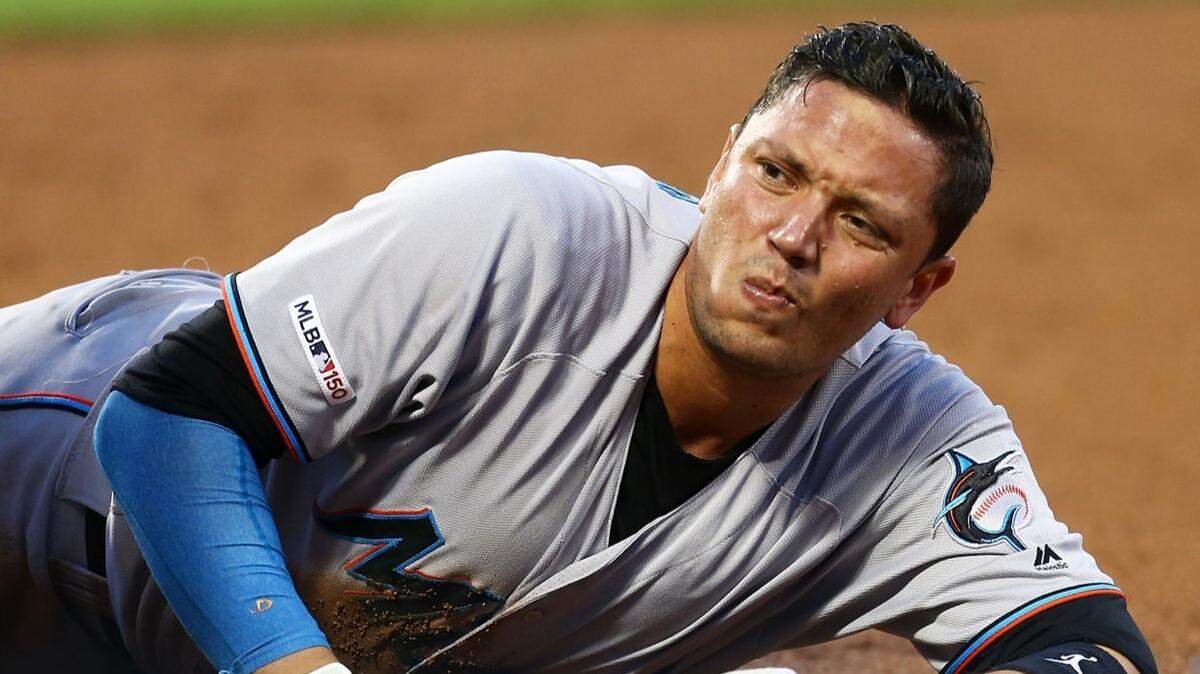 Miami Marlins shortstop Miguel Rojas reacts after being injured in the third innings against the New York Mest at Citi Field on Tuesday, Aug. 6, 2019.
