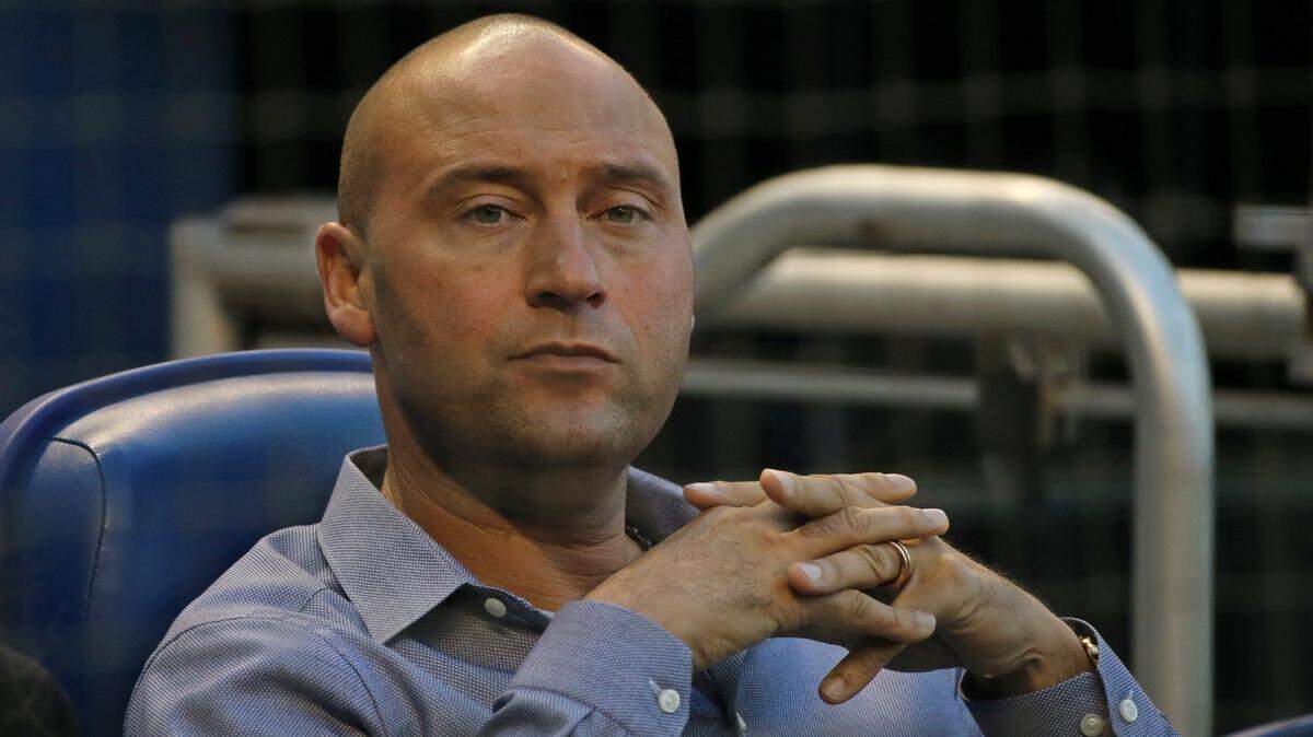 Miami Marlins CEO Derek Jeter looks on before the start of a Major League Baseball game against the Chicago Cubs at Marlins Park in Miami on Friday, March 30, 2018.