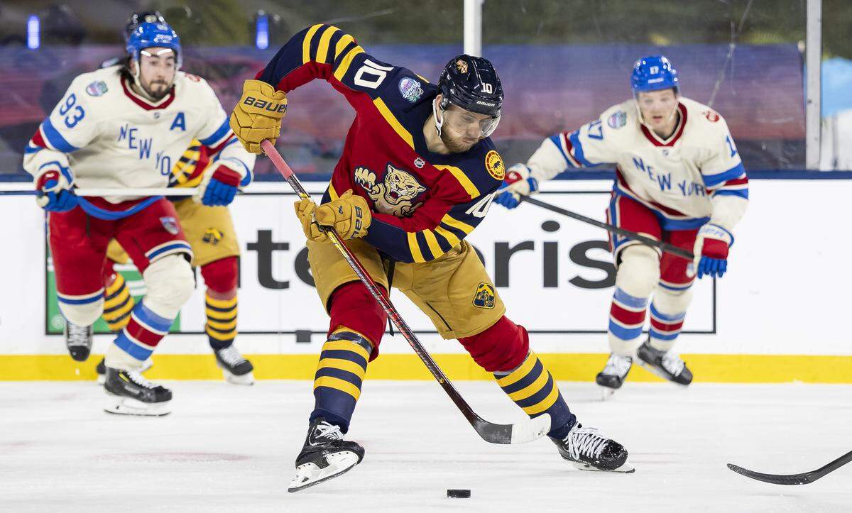Florida Panthers left wing A.J. Greer (10) skates with the puck in the third period of his Winter Classic outdoor hockey game against the New York Rangers at loanDepot park on Friday, Jan. 2, 2026, in Miami, Fla.