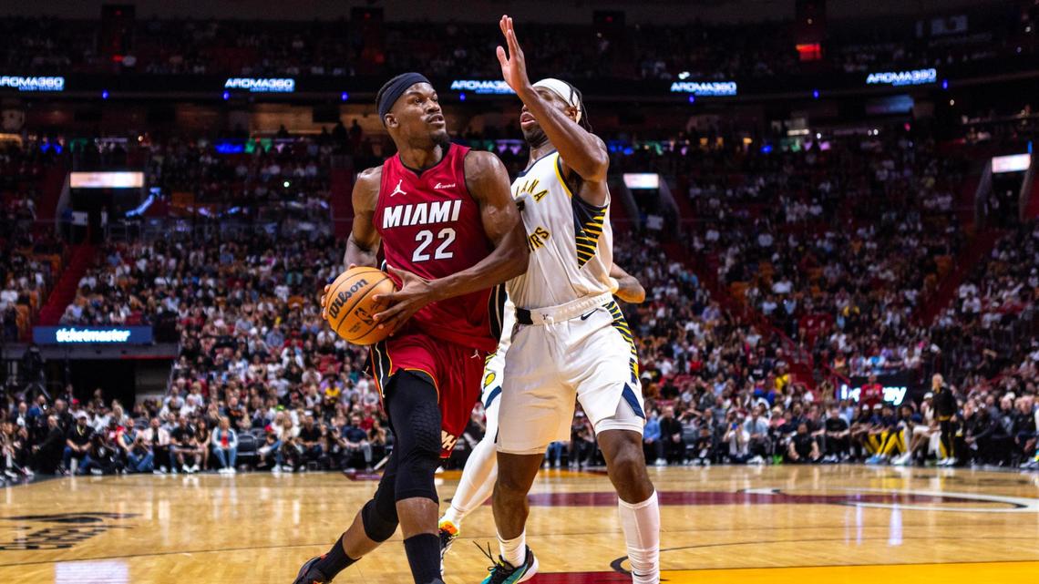 Miami Heat center Bam Adebayo (13) dunks the ball as Indiana Pacers point guard Tyrese Haliburton (0) attempts a block during the first quarter of an NBA game at Kaseya Center in Miami, Florida, on Thursday, November 30, 2023.