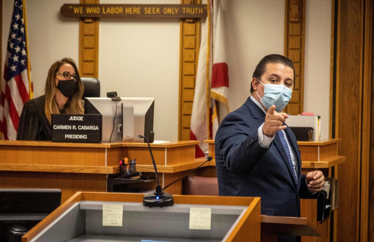 Miami, Florida, October 26, 2021 - Prosecutor Khalil Quinan points at Father Jean Philippe, during opening statements as Judge Carmen R. Cabarga listens. Father Jean Philippe, of Sacred Heart Catholic Church in Homestead is accused of raping a parishioner in 2018.
