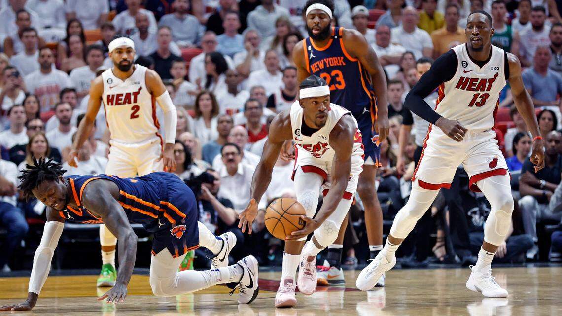 Miami Heat forward Jimmy Butler (22) picks up a loose ball in the first quarter during the game against the New York Knicks in Game 6 of the NBA Eastern Conference Semifinals at the Kaseya Center in Miami on Friday, May 12, 2023.