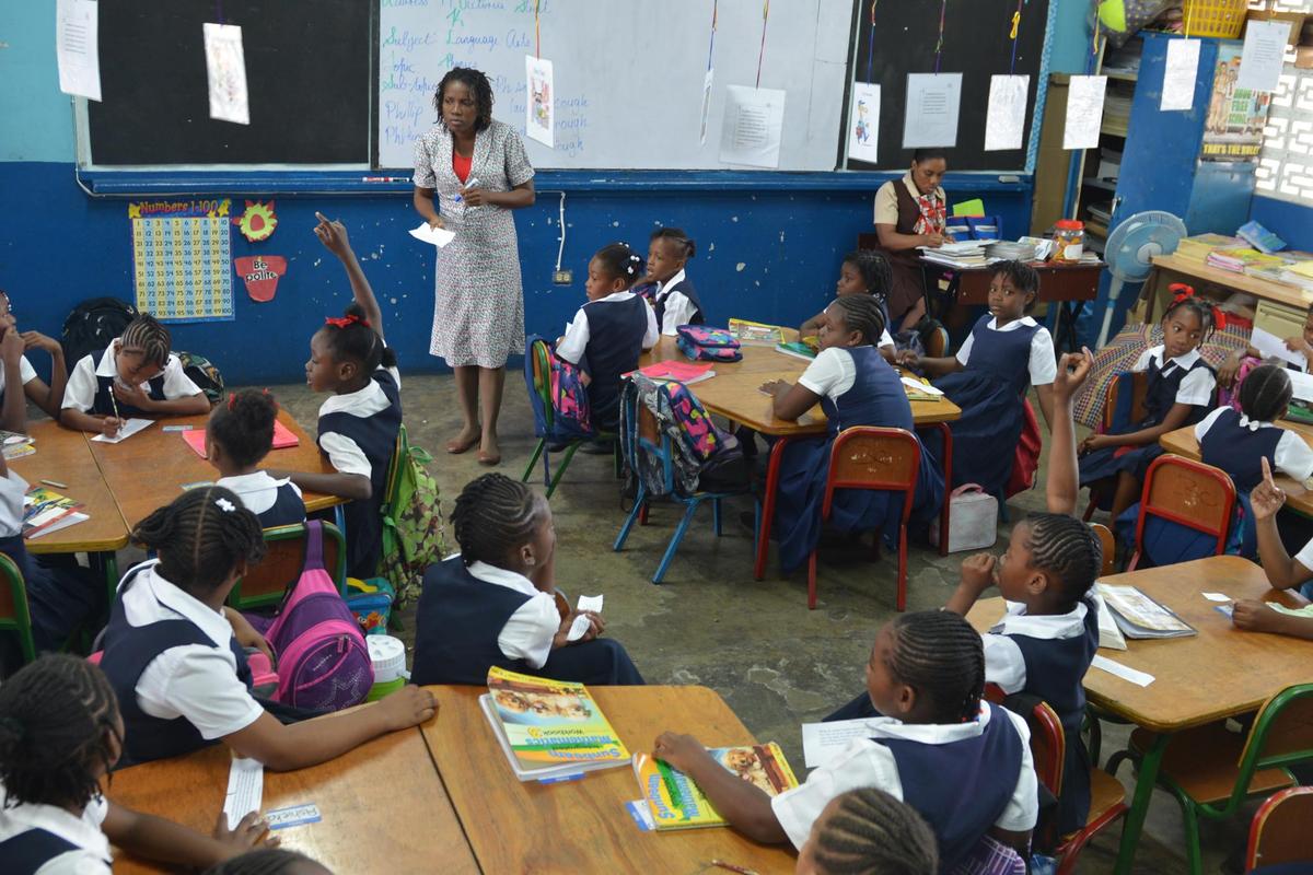 Third-grade teacher Allison Clarke leads an all-girls classroom at a co-ed Jamaican primary school experimenting with single-sex classrooms in Kingston, Jamaica, in 2015. Though corporal punishment in schools is discouraged, it is still used, said UNICEF, which wants it banned.