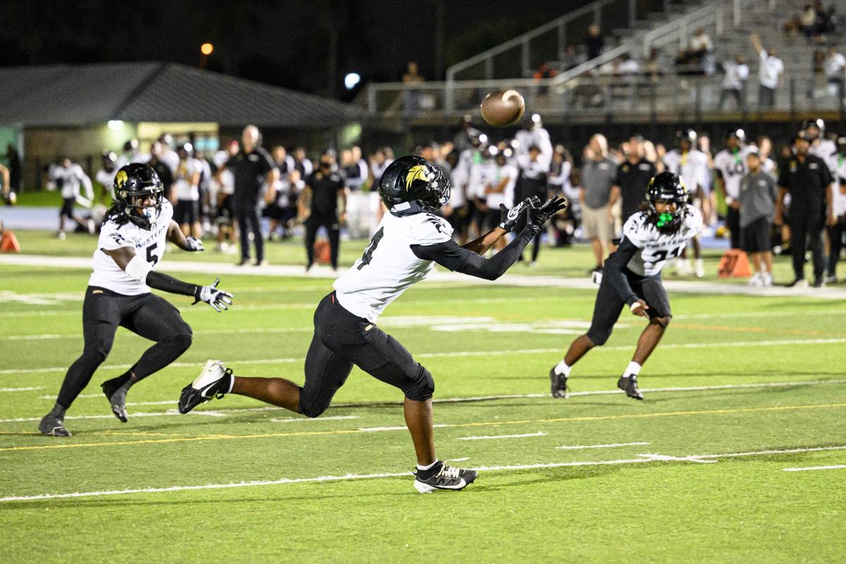 Western High School Safety Jaylin Jones (4) makes an interception during the game at Tropical Park on Friday, Nov. 15, 2024 in Miami, Fla. (Ruben Gonzalez/Miami Herald)