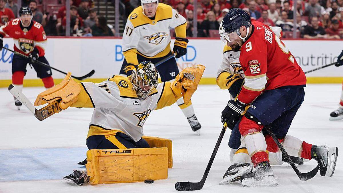 SUNRISE, FLORIDA - DECEMBER 04: Juuse Saros #74 of the Nashville Predators makes a save on Sam Bennett #9 of the Florida Panthers during the second period at Amerant Bank Arena on December 04, 2025 in Sunrise, Florida. (Photo by Carmen Mandato/Getty Images)
