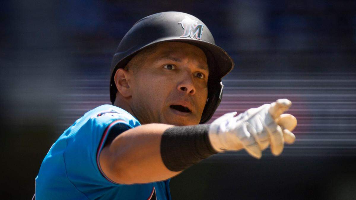 Miami Marlins right fielder Avisail Garcia (24) points into the dugout after hitting a home run during the fourth inning of a baseball game on Sunday, March 31, 2024, at loanDepot Park in Miami.