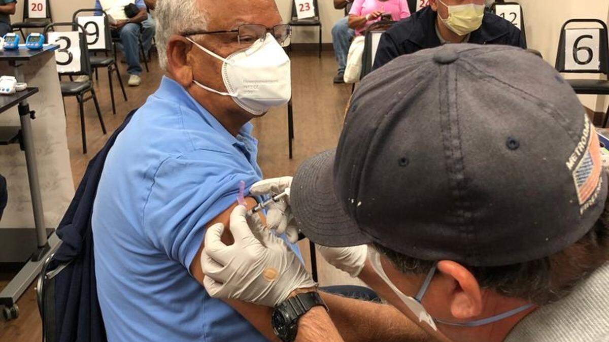 Khalid Mizra, chairman of the Islamic Center of Greater Miami, gets his vaccine against COVID-19 through a partnership with the Islamic Center of Greater Miami on Jan. 13, 2021.