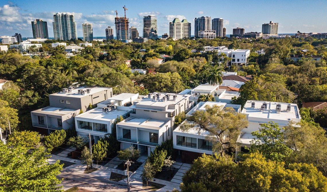 Several of the 12 townhouses in the 2900 block of Coconut Avenue in Coconut Grove on Wednesday, Feb. 15, 2023. Buyers who have put down deposits as much as $500,000 dating back to 2018 say they haven’t been able to move into the homes due to perpetual delays by their developer, Doug Cox of Drive Development.