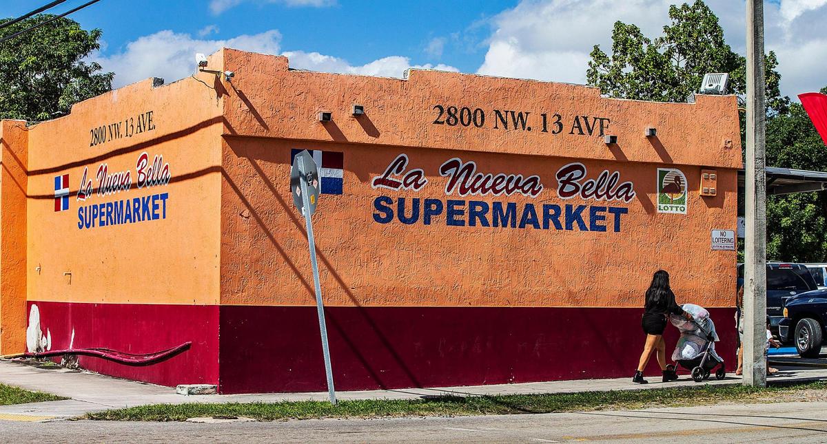 In the 1990s, the Dominican community grew so much so that in 2003 the city designated Northwest 17th Avenue Little Santo Domingo. Above: A woman walk by La Nueva Bella Supermarket located at 2800 NW 13 Avenue in Allapattah, on Sunday October 30, 2022.