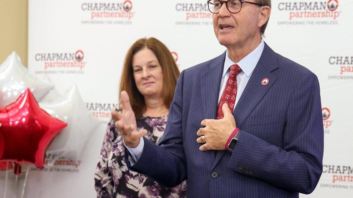 Peter T. Pruitt, president and CEO of the Chapman Partnership, announces on Tuesday, Nov. 22, 2022 in Miami that the organization has received $5 million from this year’s Bezos Day 1 Families Fund grant. On the left is Victoria L. Mallette, the executive director of the Miami-Dade County Homeless Trust.