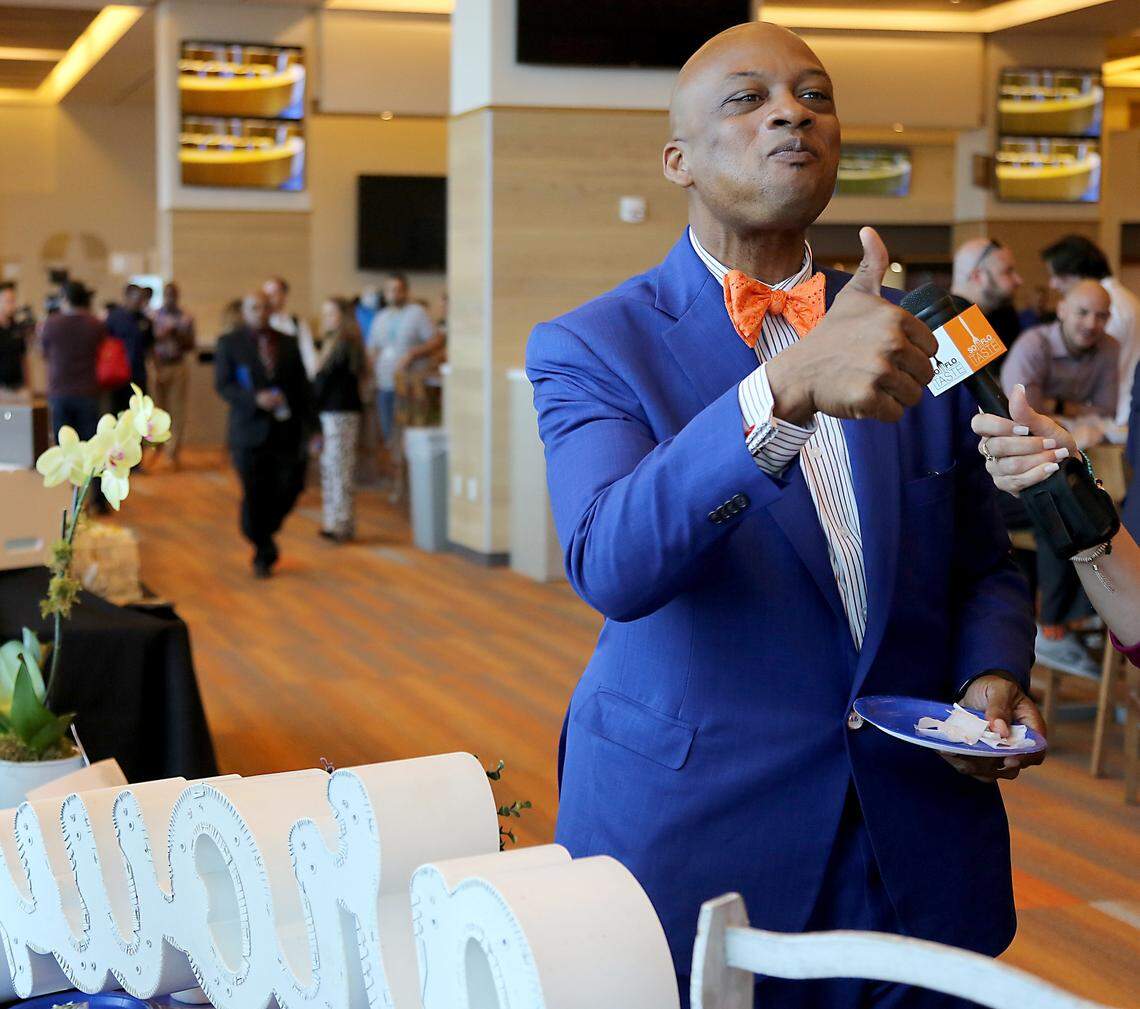 Miami Gardens Mayor Oliver G. Gilbert III gives the thumbs-up to Grown’s vegetarian wrap as he samples the food offerings at Hard Rock Stadium on Tuesday, Aug. 7, 2018.