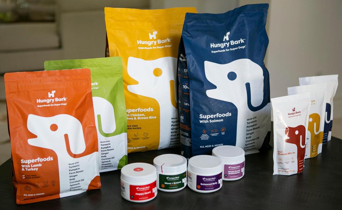 Various Hungry Bark dog food products are on display at the house of Nick Molina in Miami, Florida, on Oct. 6, 2020. Molina’s startup is designed to help dogs reach their peak performance by personalizing dog food for them.