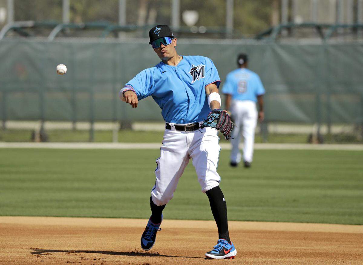 Miami Marlins shortstop Miguel Rojas (19) run drills during the first full-squad spring training workout at Roger Dean Stadium on Monday, February 17, 2020 in Jupiter, FL.