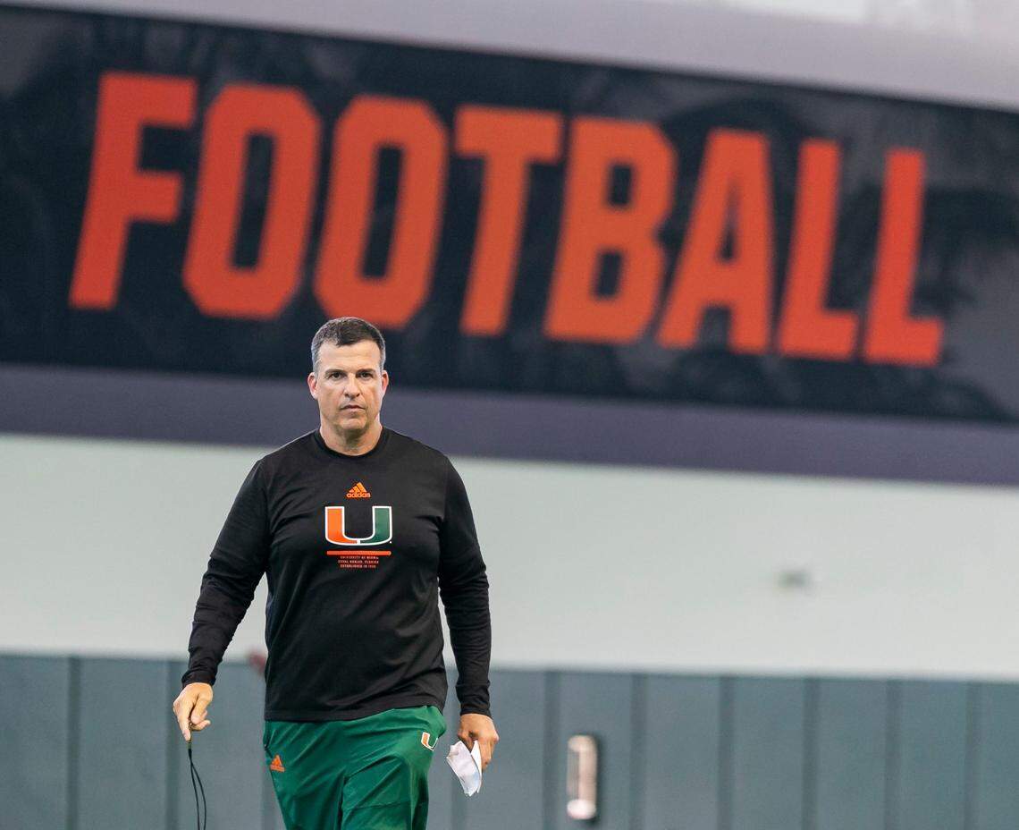 Miami Hurricanes head coach Mario Cristobal strides across the University of Miami’s Greentree Practice Fields on Monday, August 15, 2022, in Coral Gables, Fla.