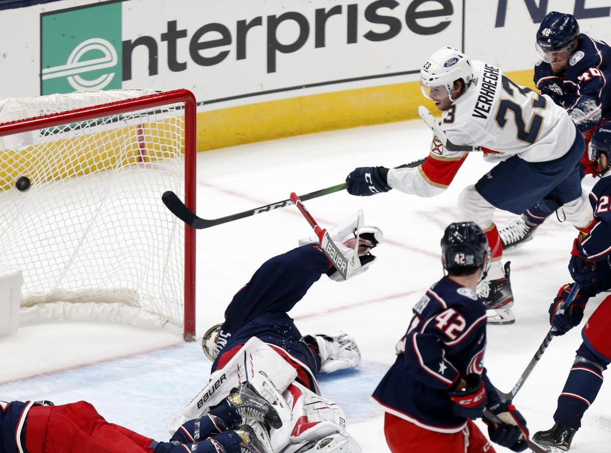 Florida Panthers forward Carter Verhaeghe (23) scores past Columbus Blue Jackets goalie Elvis Merzlikins as Blue Jackets forward Alexandre Texier (42) and defenseman Dean Kukan (46) try to defend during the second period of an NHL hockey game in Columbus, Ohio, Thursday, Jan. 28, 2021.