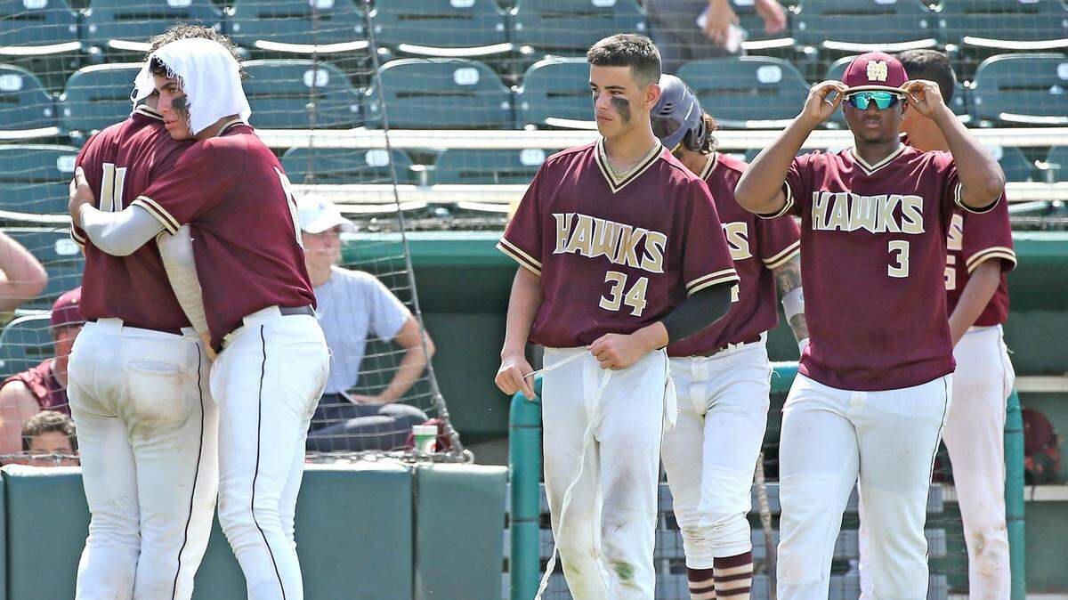 Miami Springs’ Jason Torres (11) walks away from home plate and gets a hug from Anthony Nunez (16) as they are defeated by Jesuit School in last year’s Class 6A semis. On Thursday, Torres had a complete game three-hitter.