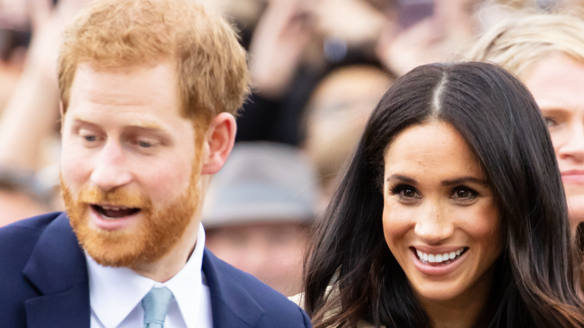 Prince Harry and Meghan Markle in a crowd.