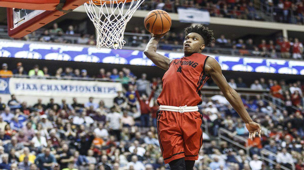 Reading's Lonnie Walker dunks against Pine Richland in the PIAA boys' Class 6A basketball final Saturday, March 25, 2017, in Hershey, Pa.