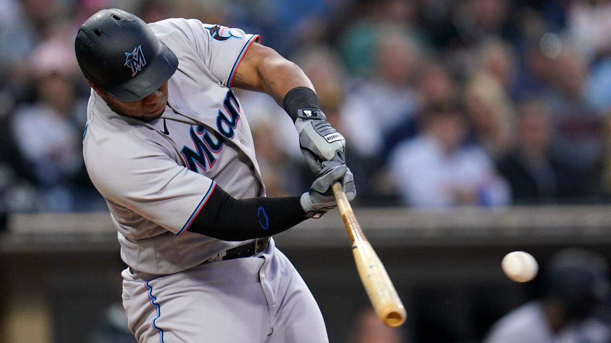 Miami Marlins’ Jesus Aguilar hits an RBI single during the third inning of a baseball game against the San Diego Padres, Thursday, May 5, 2022, in San Diego.