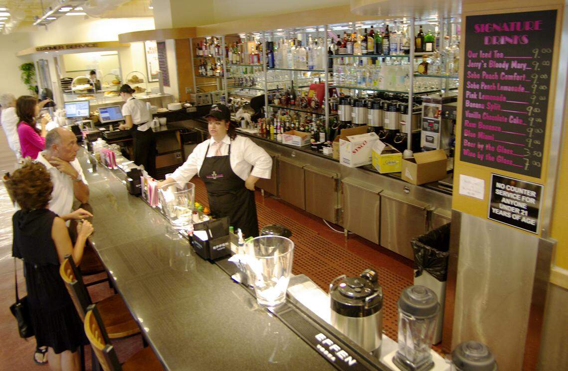 11/8/08- The Epicure Market in Sunny Isles Beach serves cocktails at an inside bar. The store’s sale of packaged liquor - which incudes bottles of spirits - was the subject of debate at a recent commission meeting . CHRIS CUTRO / FOR THE MIAMI HERALD.