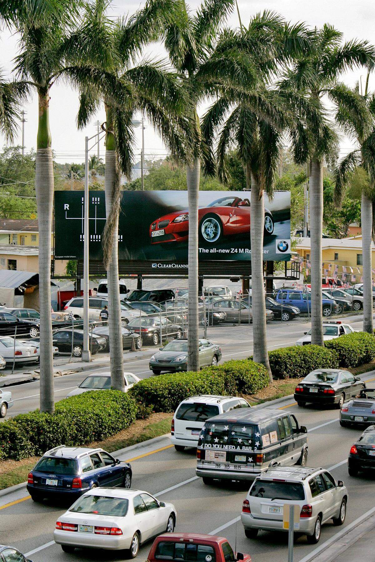 Royal palm trees in the median of South Dixie Highway just south of Douglas Road block southbound drivers’ view of an advertising billboard in 2006.