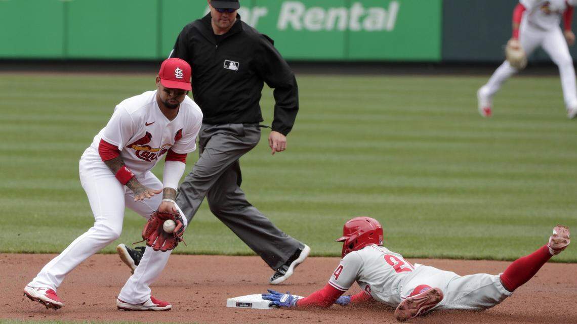 Philadelphia Phillies’ Roman Quinn (24) steals second base as St. Louis Cardinals’ Edmundo Sosa fields the late throw in the second inning of a baseball game, Thursday, April 29, 2021 in St. Louis. Second Base umpire Jordan Baker looks on.(AP Photo/Tom Gannam)
