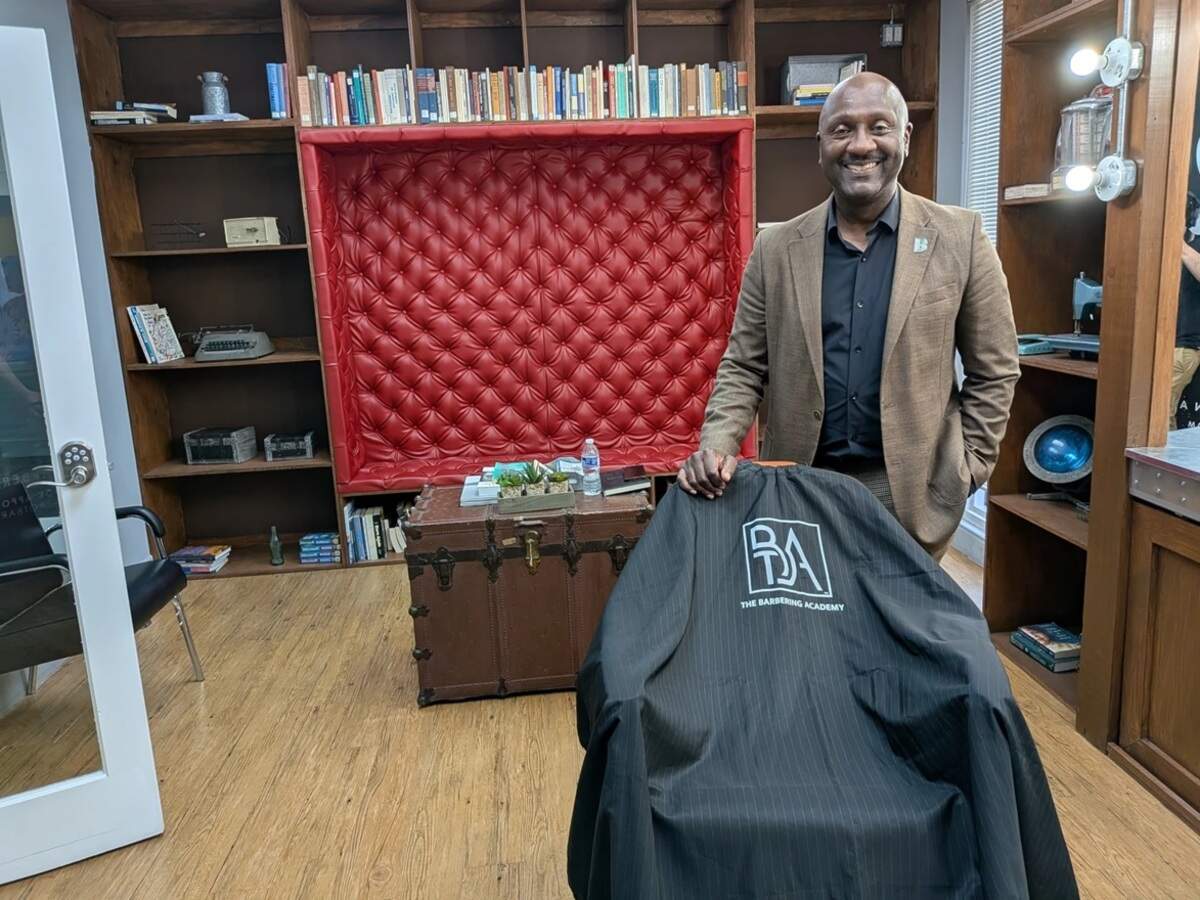 Gale Nelson, president and CEO of Big Brothers Big Sisters of Miami, poses in the organization’s barbershop studio, where members can learn skills. Nelson says Hard Rock Stadium and events like the World Cup offer a chance for the youth of Miami Gardens to capitalize on the buzz.