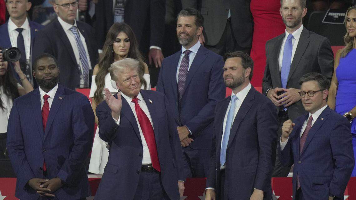 Then-Republican presidential nominee Donald Trump with (from left) Rep. Byron Donalds, Kimberly Guilfoyle, Donald Trump Jr., vice presidential nominee Sen. J.D. Vance, Eric Trump and Speaker Mike Johnson at the first day of the Republican National Convention. 