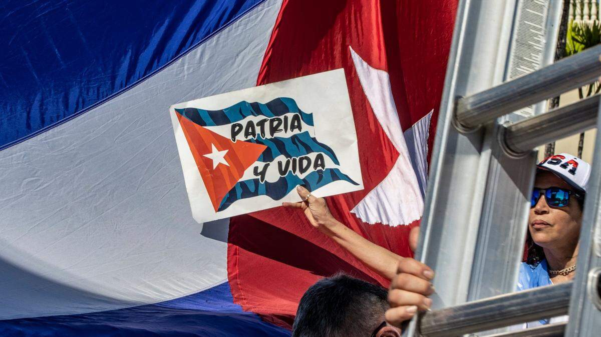 Maribel Gonzalez joined a group of Cuban exiles protesting at Versailles Restaurant in Little Havana to commemorate the first anniversary of the July 11, 2021, mass protests in Cuba, on Monday July 11, 2022.