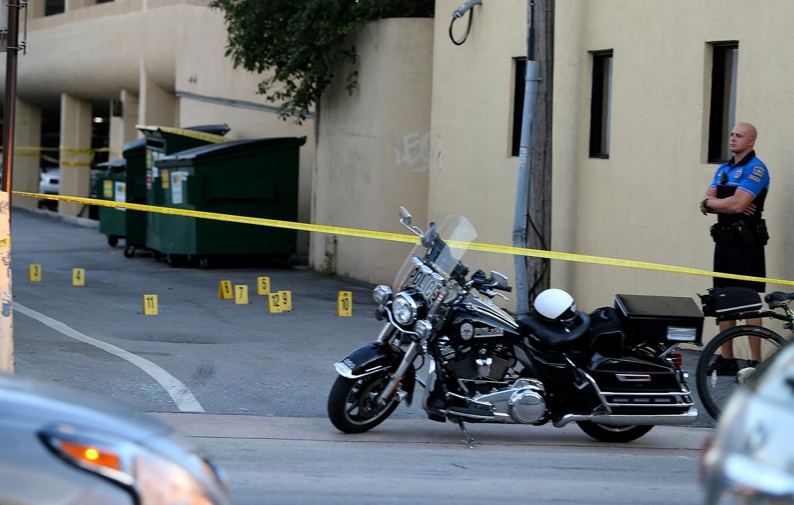 Coral Gables police officers guard a crime scene perimeter on an alleyway south of Coral Way after a robbery at Regent Jewelers at 386 Miracle Mile on Thursday, Dec. 5, 2019.