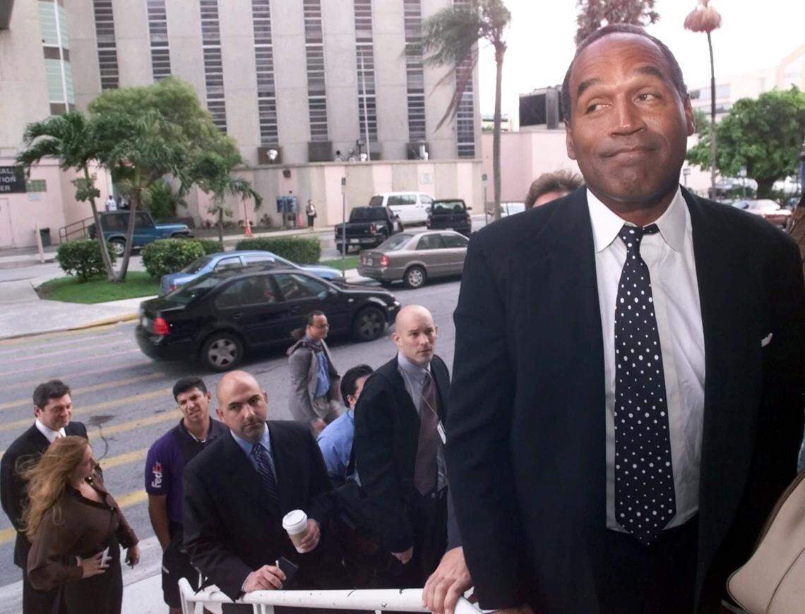 O.J. Simpson waits in line to enter the Miami circuit court on Oct. 9, 2001, in Miami for the jury selection phase of his trial on felony auto burglary and misdemeanor battery charges, stemming from an angry encounter with another motorist in his suburban Miami neighborhood. Simpson was accused of scratching the motorist’s face while pulling off his glasses.