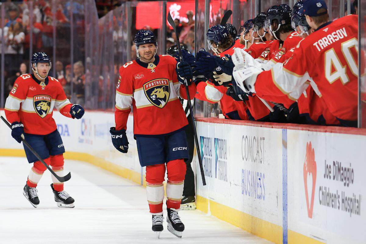 Sam Reinhart #13 of the Florida Panthers celebrates with teammates after scoring a goal against the Vegas Golden Knights during the first period of the game at Amerant Bank Arena on October 25, 2025 in Sunrise, Florida.