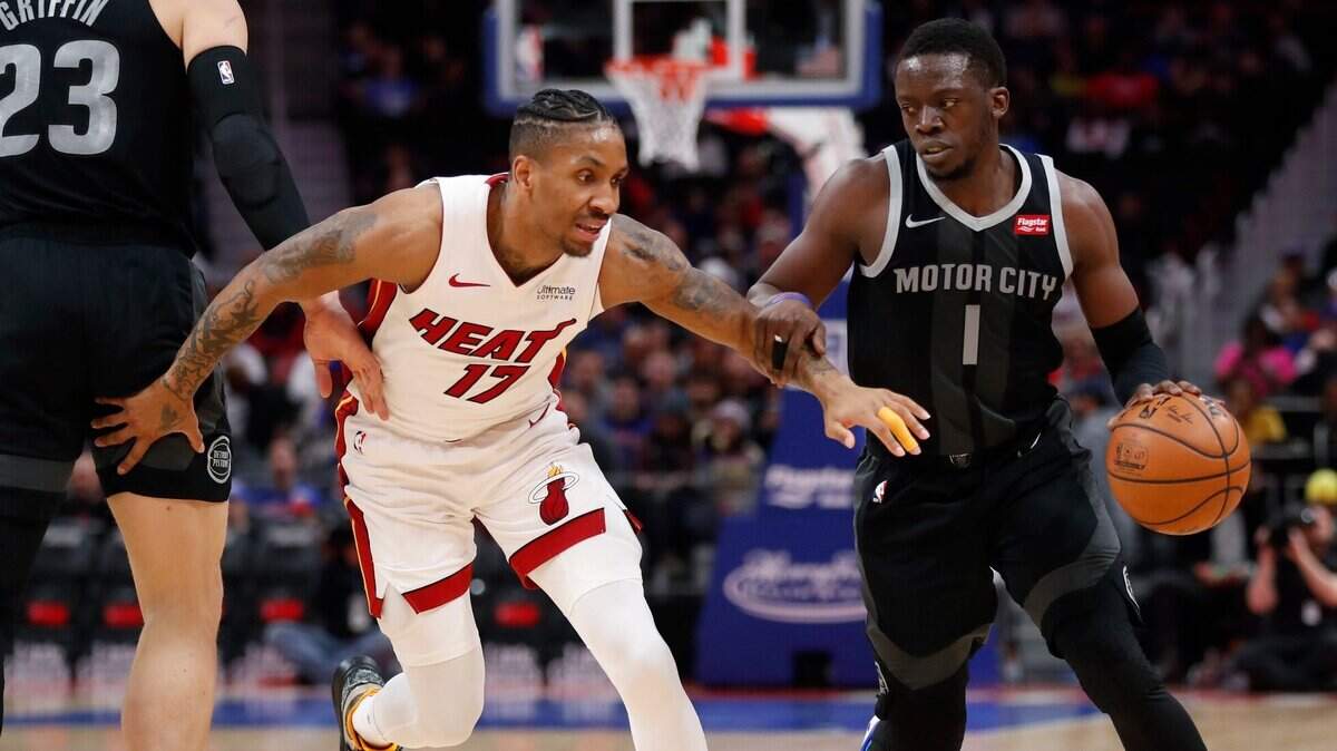 Detroit Pistons guard Reggie Jackson (1) drives around Miami Heat forward Rodney McGruder (17) during the first half of an NBA basketball game, Friday, Jan. 18, 2019, in Detroit.