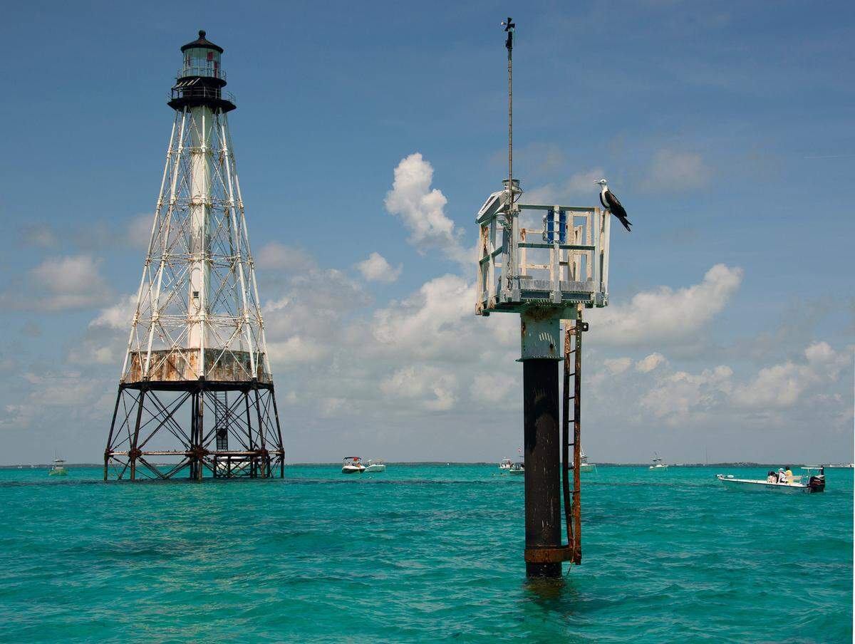Boats are anchored around Alligator Reef Lighthouse Tuesday, Sept. 7, 2021, off Islamorada, Fla., in the Florida Keys National Marine Sanctuary. On Tuesday, officials from the Islamorada-based organization Friends of the Pool, Inc., announced that the federal government had approved granting it ownership of the lighthouse under the National Historic Lighthouse Preservation Act. Friends of the Pool hopes to raise about $9 million to preserve the almost 150-year-old structure.