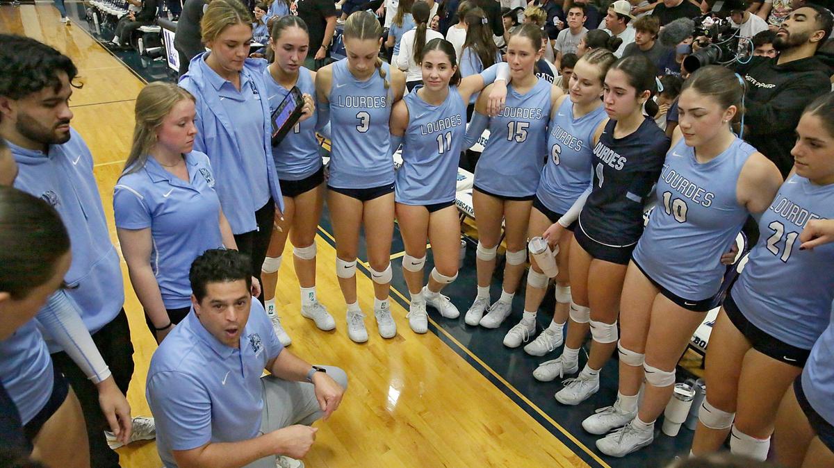 Our Lady of Lourdes Academy Bobcats head coach Pedro Penate talks to his players during a timeout in the Region 4-5A Girls Volleyball championship against Archbishop McCarthy Mavericks on Wednesday, October 30, 2024 at Our Lady of Lourdes Academy in Miami.