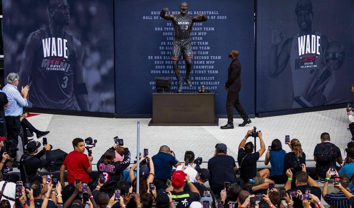 Miami, Florida, October 27, 2024- Dwyane Wade checks out his statue after it was unveiled during an unveiling ceremony in front of Kaseya Center in downtown Miami..