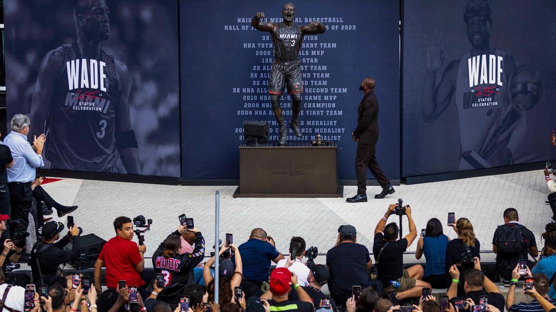 Miami, Florida, October 27, 2024- Dwyane Wade checks out his statue after it was unveiled during an unveiling ceremony in front of Kaseya Center in downtown Miami..