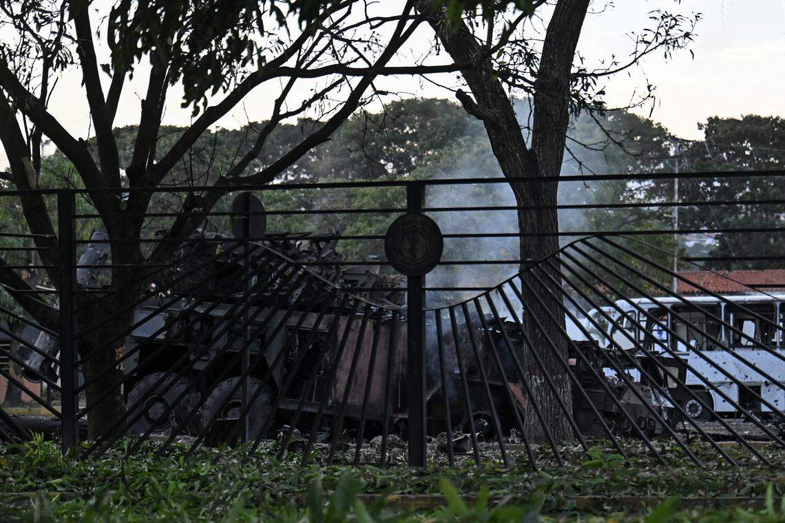A burnt vehicle is seen at La Carlota air base in Caracas on January 3, 2026, after US forces captured Venezuelan leader Nicolas Maduro after launching a "large scale strike" on the South American country.