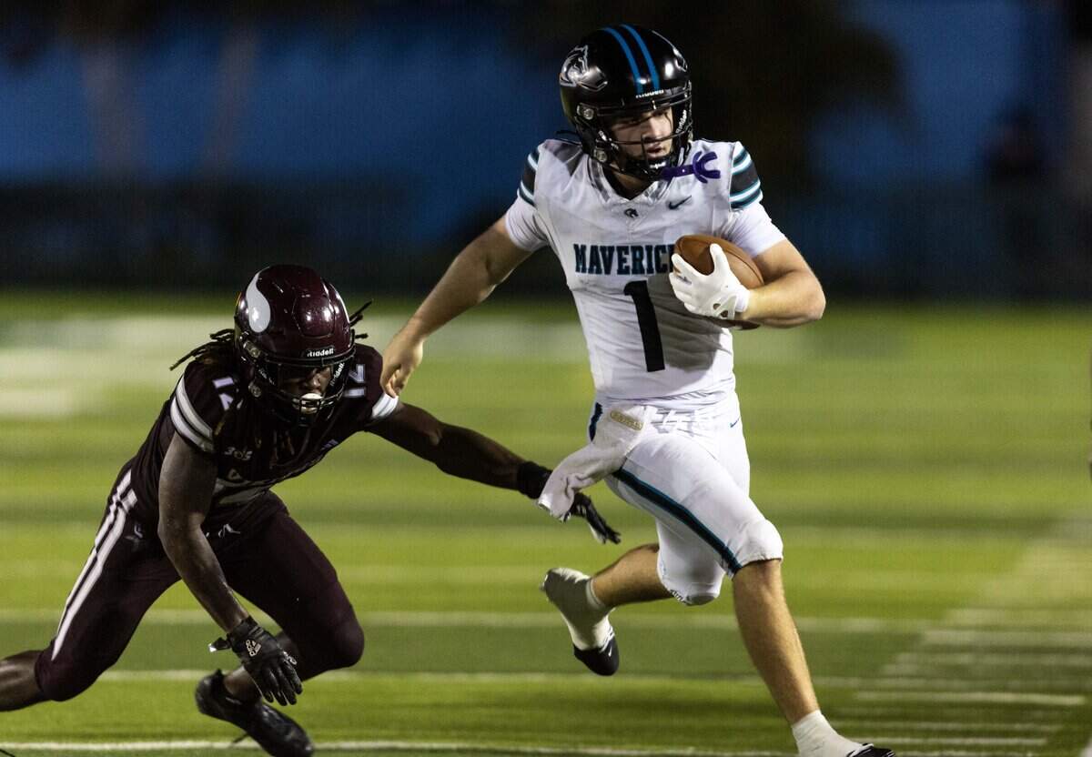 Archbishop McCarthy Mavericks quarterback Robert Kerns (1) runs the ball as Miami Norland defensive back Tedrick Oatman (12) chases after him during a high school football game at Traz Powell Stadium on Thursday, September 25, 2025, in Miami, Fla.