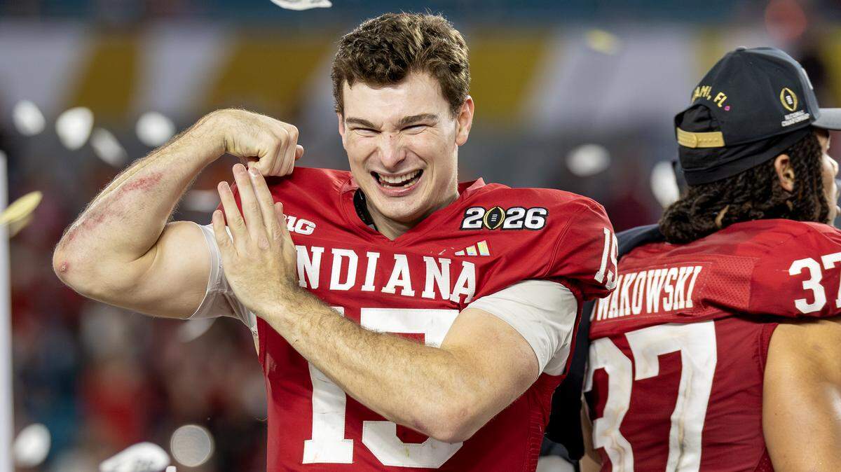 Indiana quarterback Fernando Mendoza (15) greets fans as he celebrates with tight end Riley Nowakowski (37) after a 27-21 victory over the Miami Hurricanes in the College Football Playoff national championship game at Hard Rock Stadium on Monday, Jan. 19, 2026, in Miami Gardens, Fla.