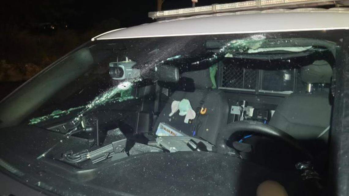 Bullet holes are shown in the windshield of a Monroe County Sheriff’s Office patrol car Thursday night, May 8, 2025.