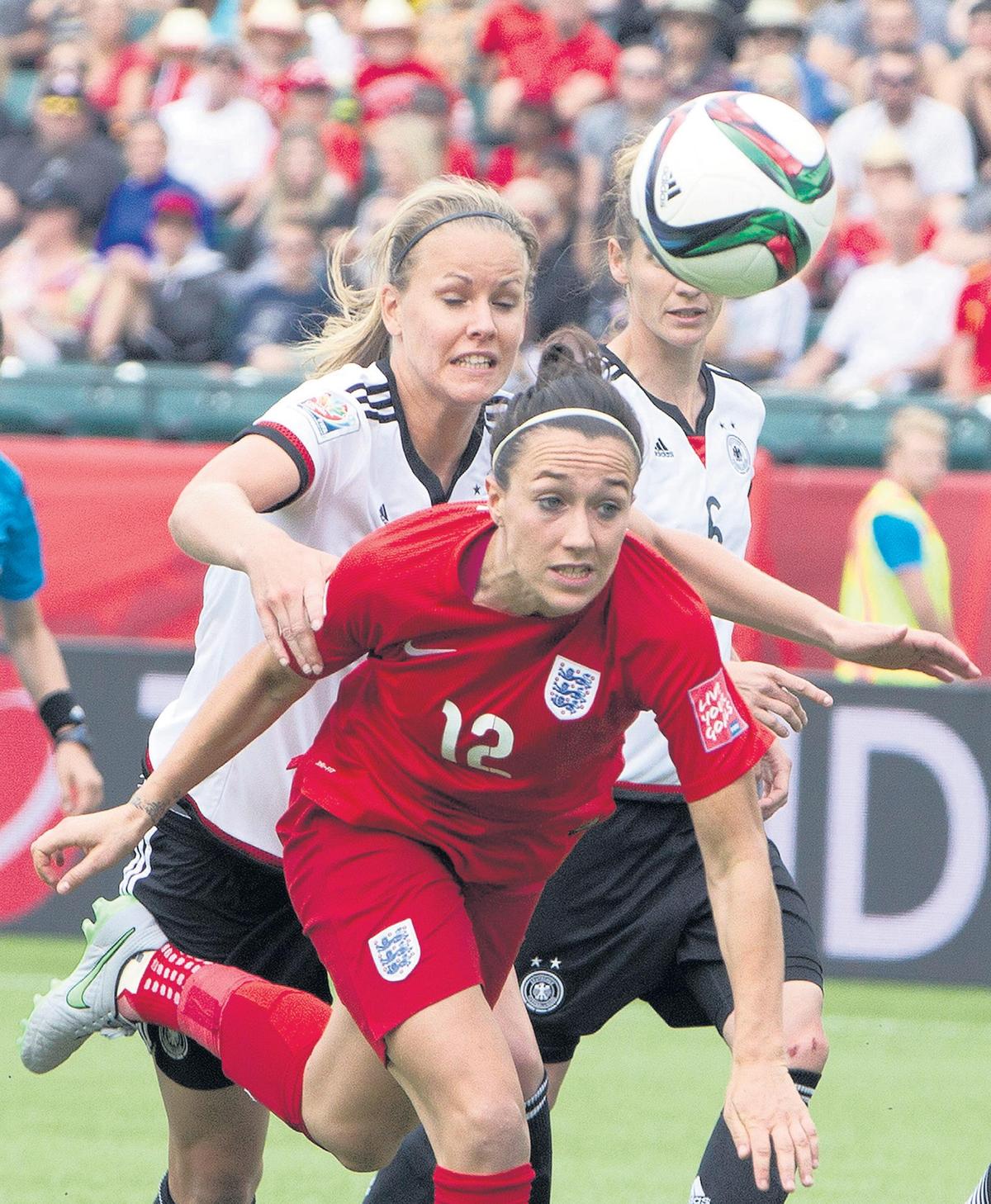 England’s Lucy Bronze — battling Germany;s Lena Petermann during the Women’s World Cup in 2015 — joins her Lyon teammates for tonight’s match against Manchester City.England won 1-0.
