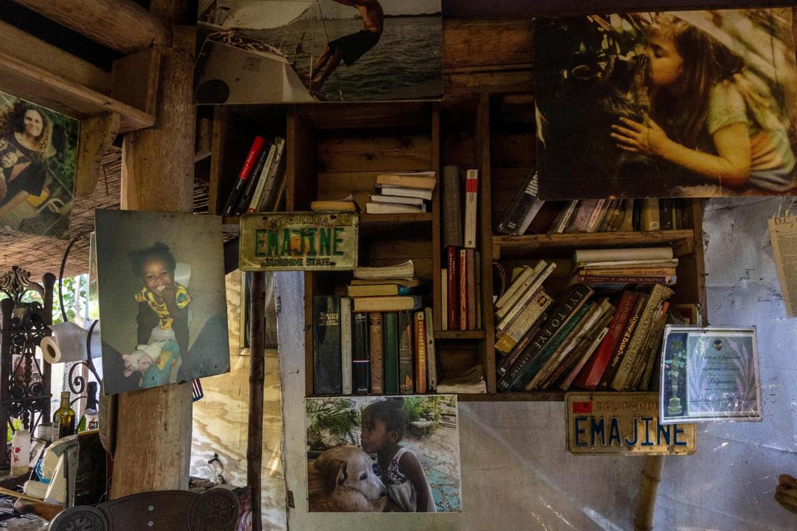 Books in Shawnee Chasser’s living room in the treehouse where she lives in unincorporated Miami-Dade near North Miami, on Friday, Sept. 8, 2023