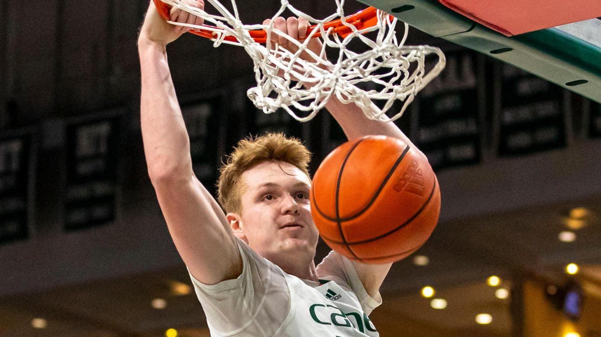 University of Miami forward Sam Waardenburg (21) dunks the ball during the first half of an NCAA basketball game against the University of North Carolina at the Watsco Center in Coral Gables, Florida, on Tuesday, January 18, 2022.