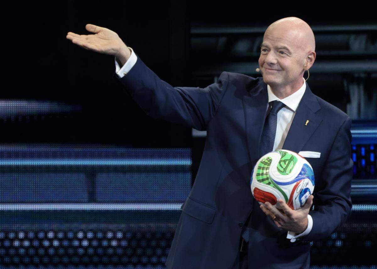 FIFA President Gianni Infantino waves at attendees as he makes his way on stage during American Business Forum at the Kaseya Center in Miami, Florida on Wednesday, November 5, 2025.