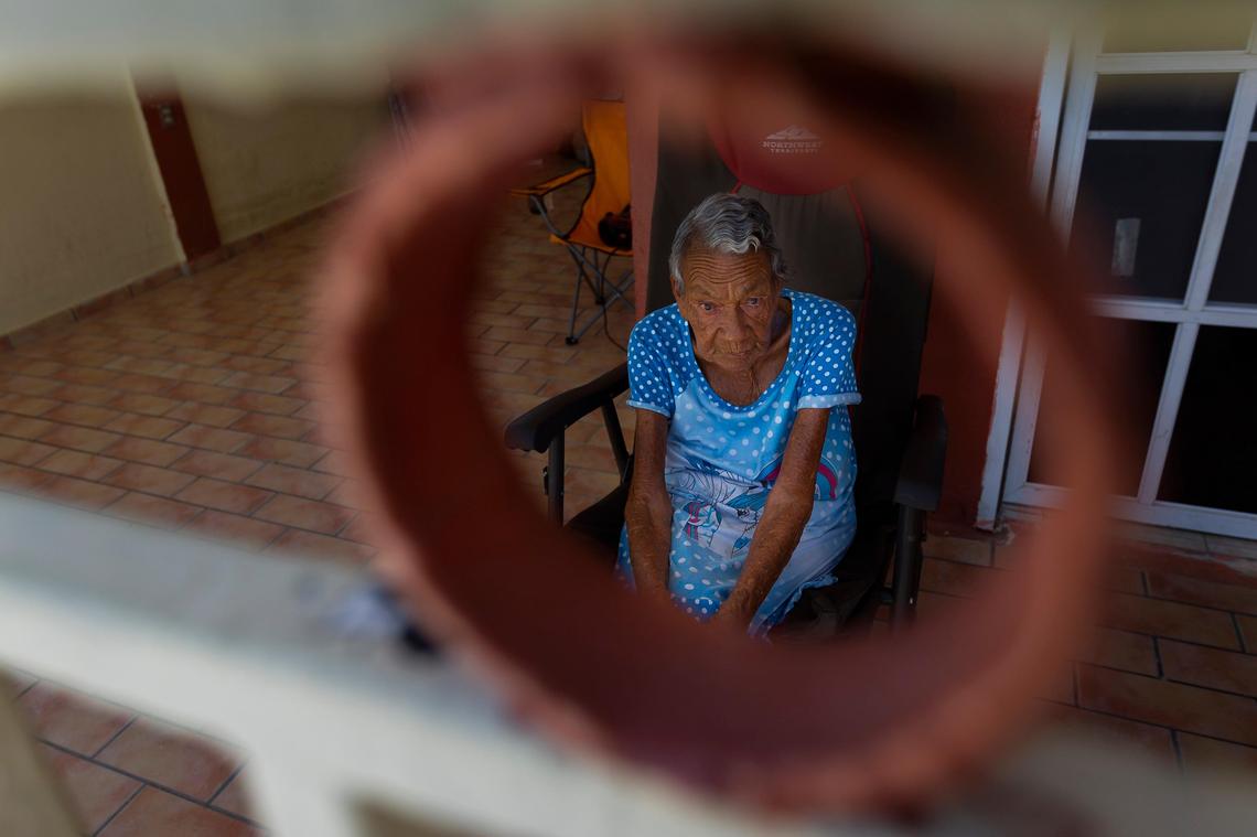 Lidia M. Rodriguez, 79, who is blind, was trapped in her home in Punta Santiago, Humacao by rising seawater during Hurricane Maria last year. A year later, Rodriguez lives with her family as they rebuild their home.