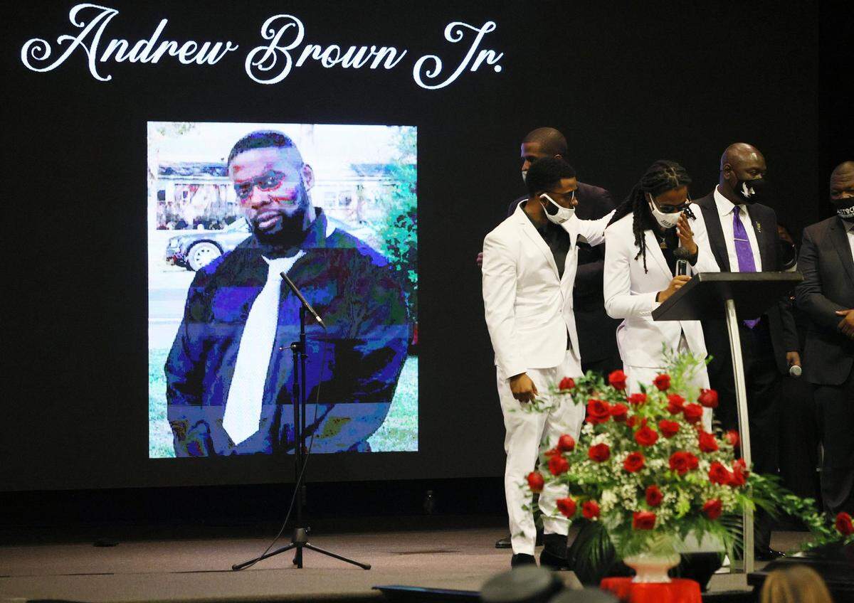 ELIZABETH CITY, NORTH CAROLINA - MAY 03: Jha’rod Ferebee (L) and Khalil Ferebee speak during the funeral for their father Andrew Brown Jr. at the Fountain of Life church on May 03, 2021 in Elizabeth City, North Carolina. Mr. Brown was shot to death by Pasquotank County Sheriff’s deputies on April 21. (Photo by Joe Raedle/Getty Images)