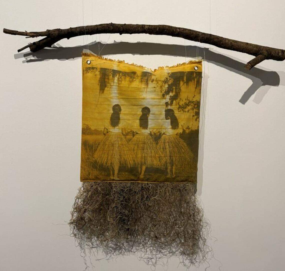 Diana Eusebio, Tequesta Women, 2024. Photograph digitally printed on cotton fabric naturally dyed and stuffed with Spanish moss plant, branch, feathers.