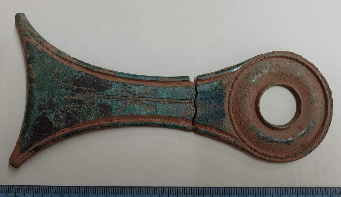 The handle of an ancient Roman saucepan.